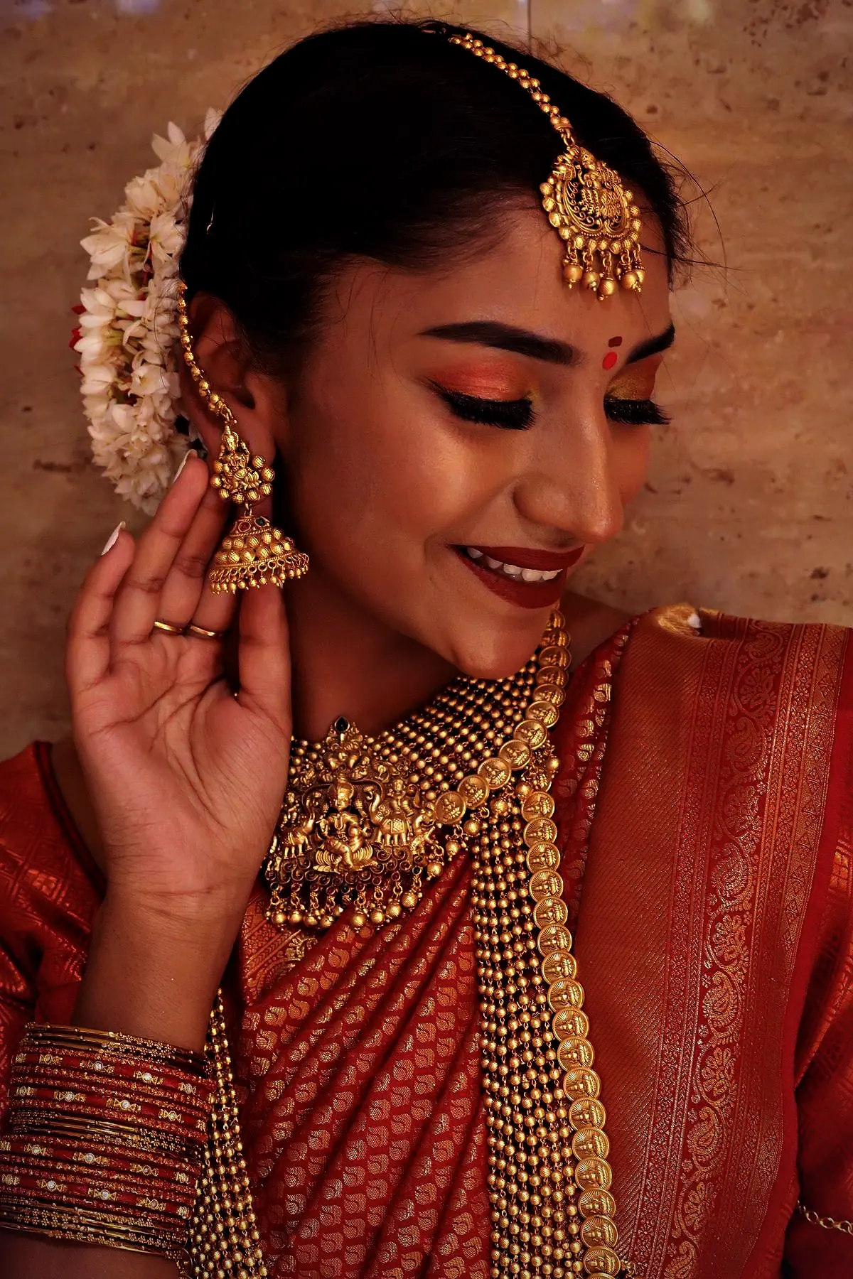 Divya on her wedding morning in ivory and antique gold