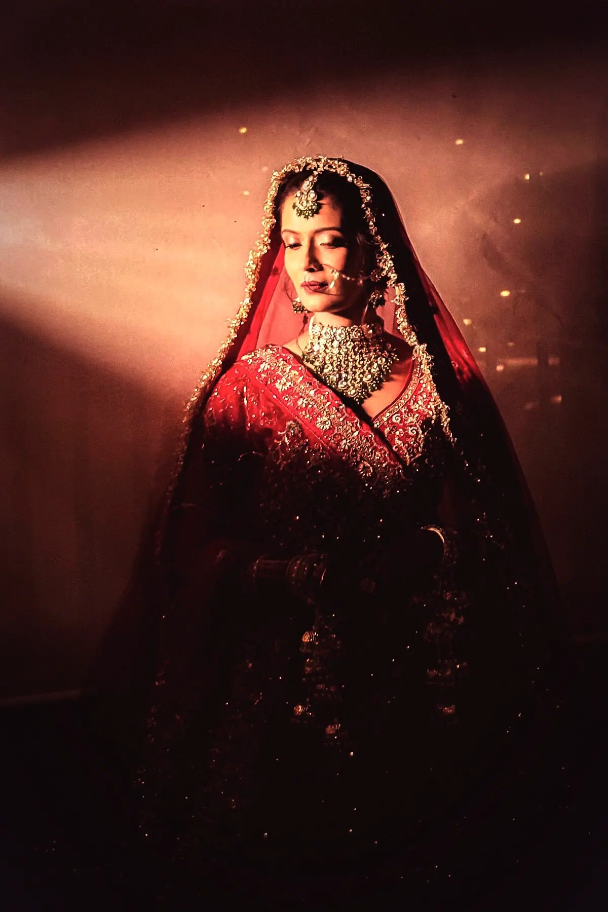 Meghana at her sangeet in a champagne zari lehenga