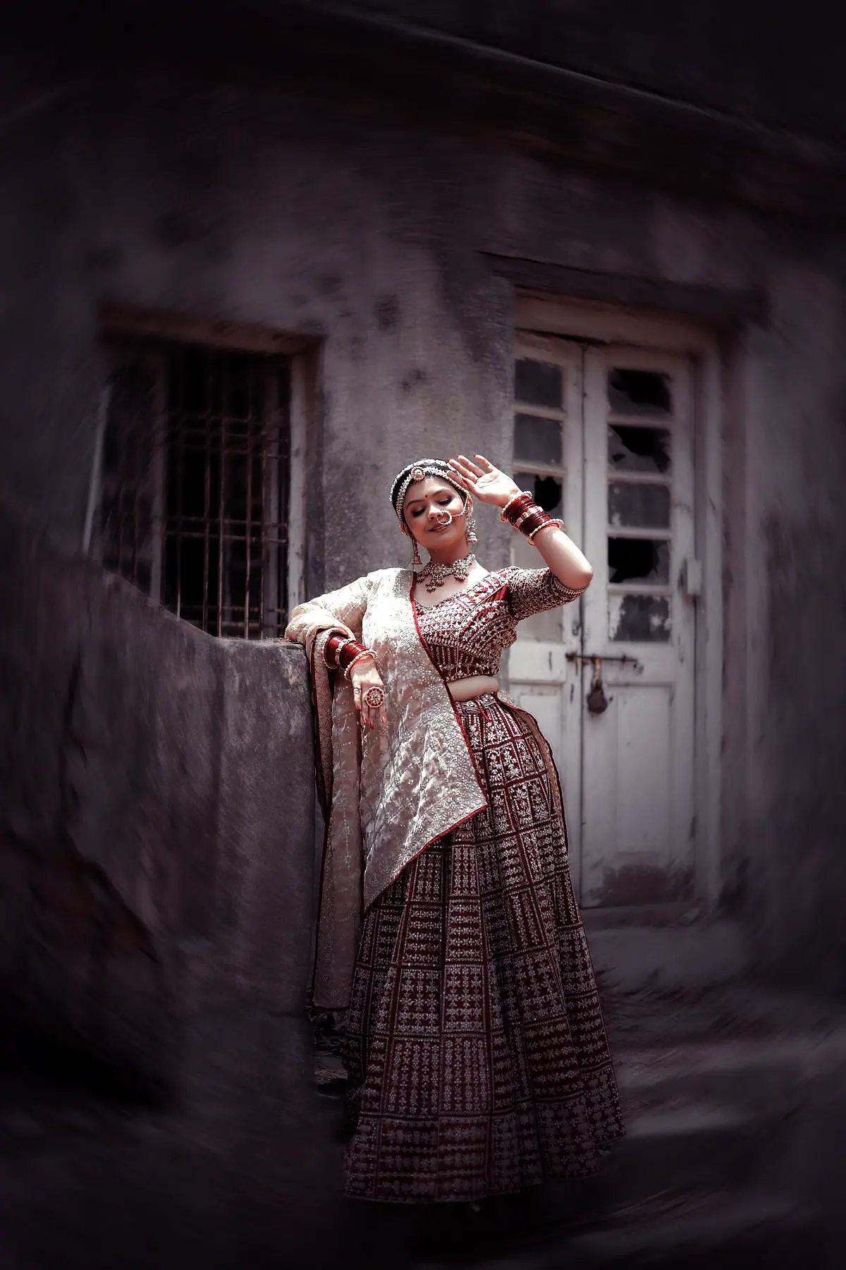 Bridal lehenga in imperial plum with hand-worked zari borders