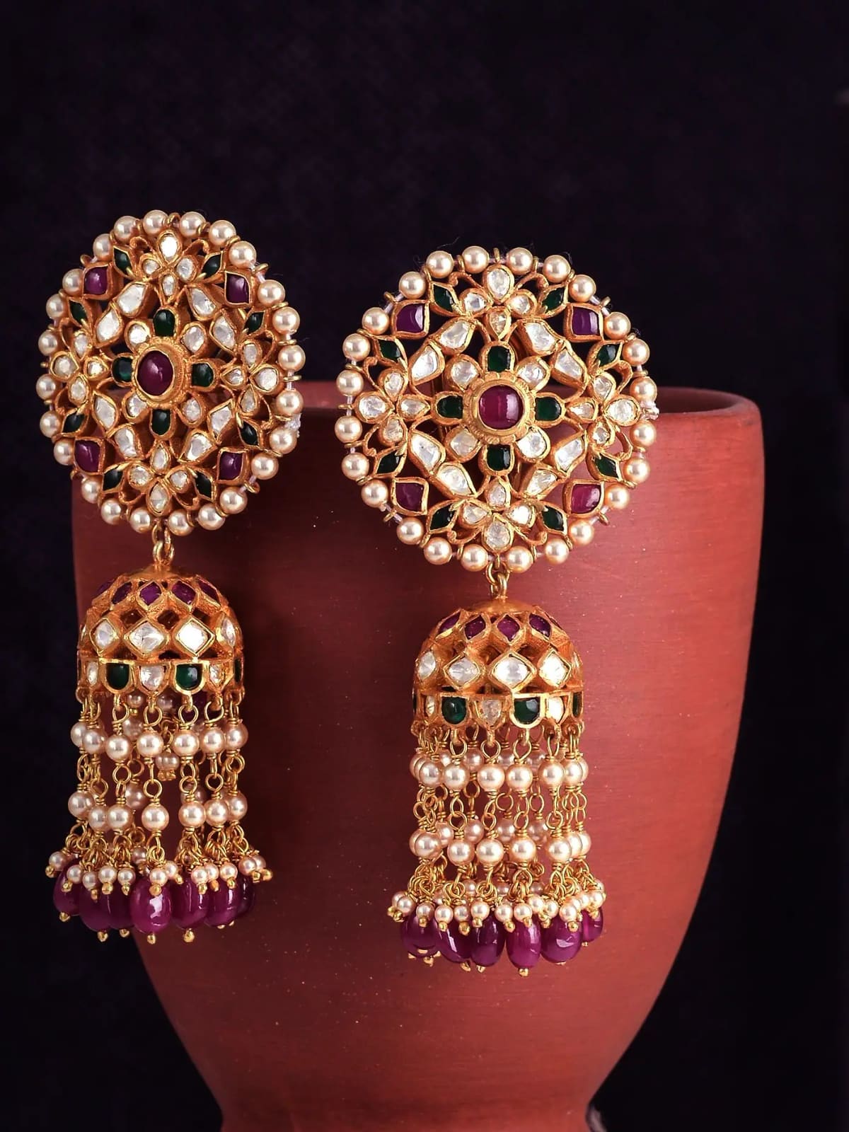 Ruby and emerald jhumkas at rest