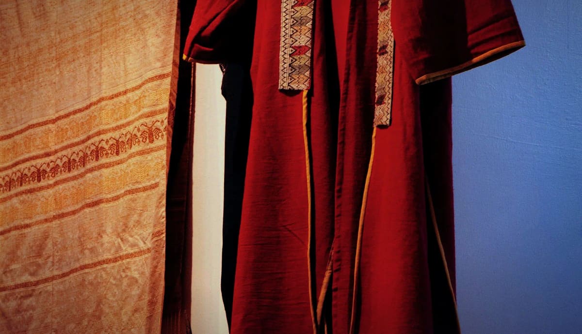 Rolls of raw silk in plum, ivory and champagne